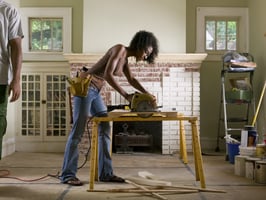 Woman doing DIY work at her house